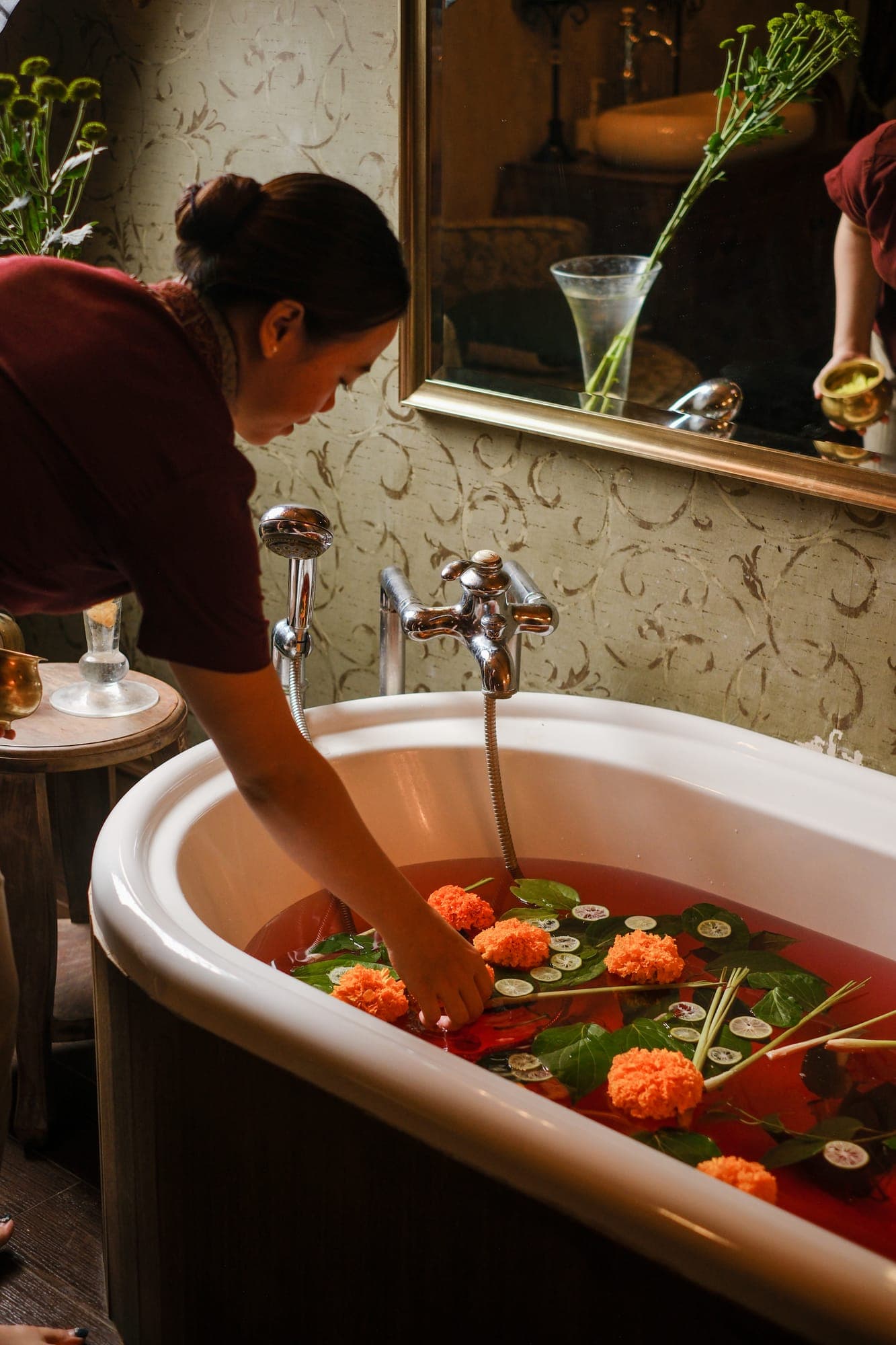 A therapist preparing a marigold bath at DaLa Spa