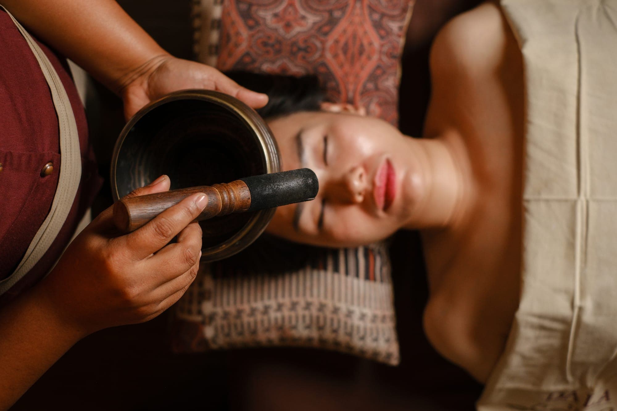 A singing bowl held over a guest at DaLa Spa