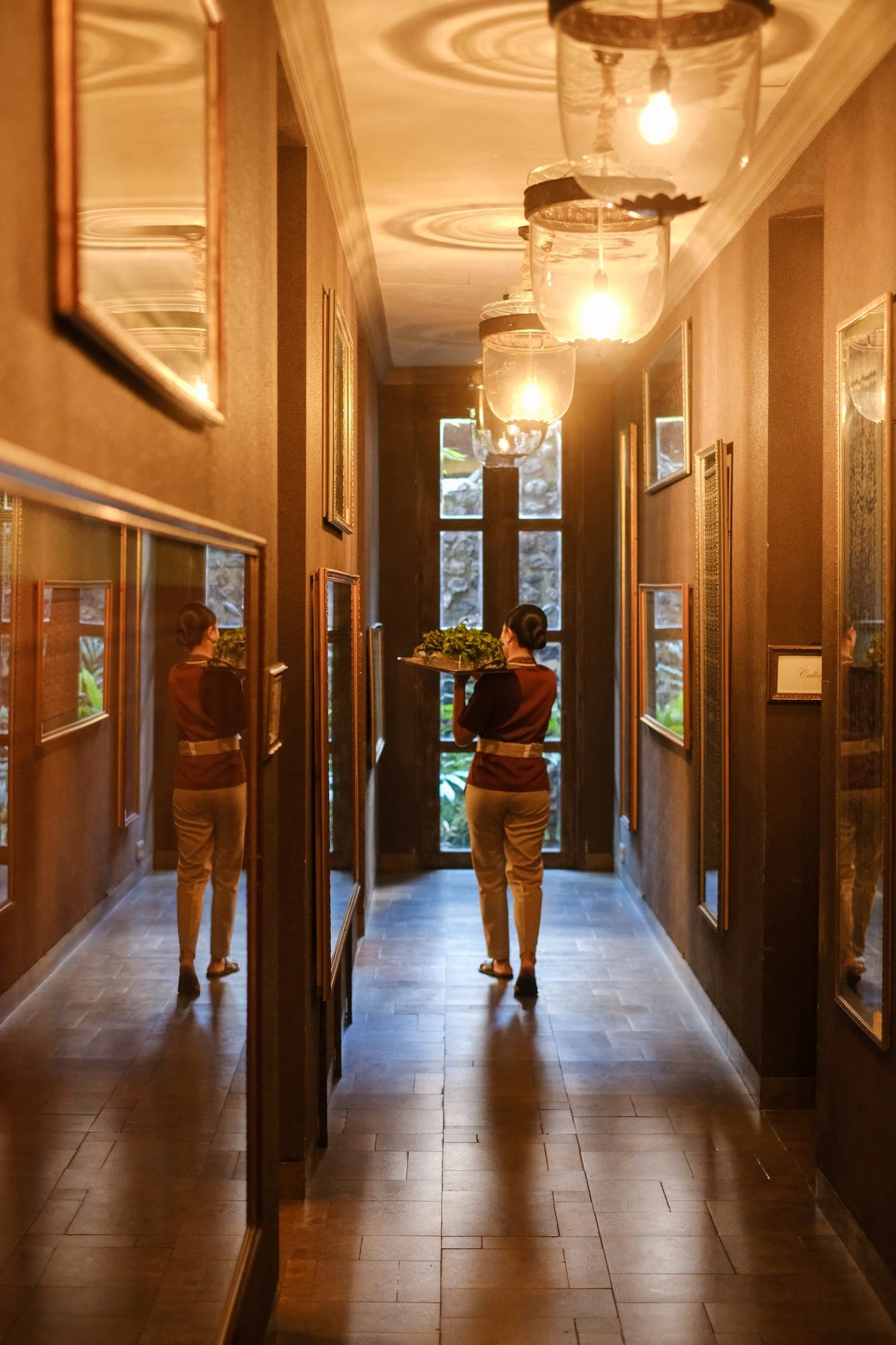 A lamp-lit corridor leading to the treatment rooms