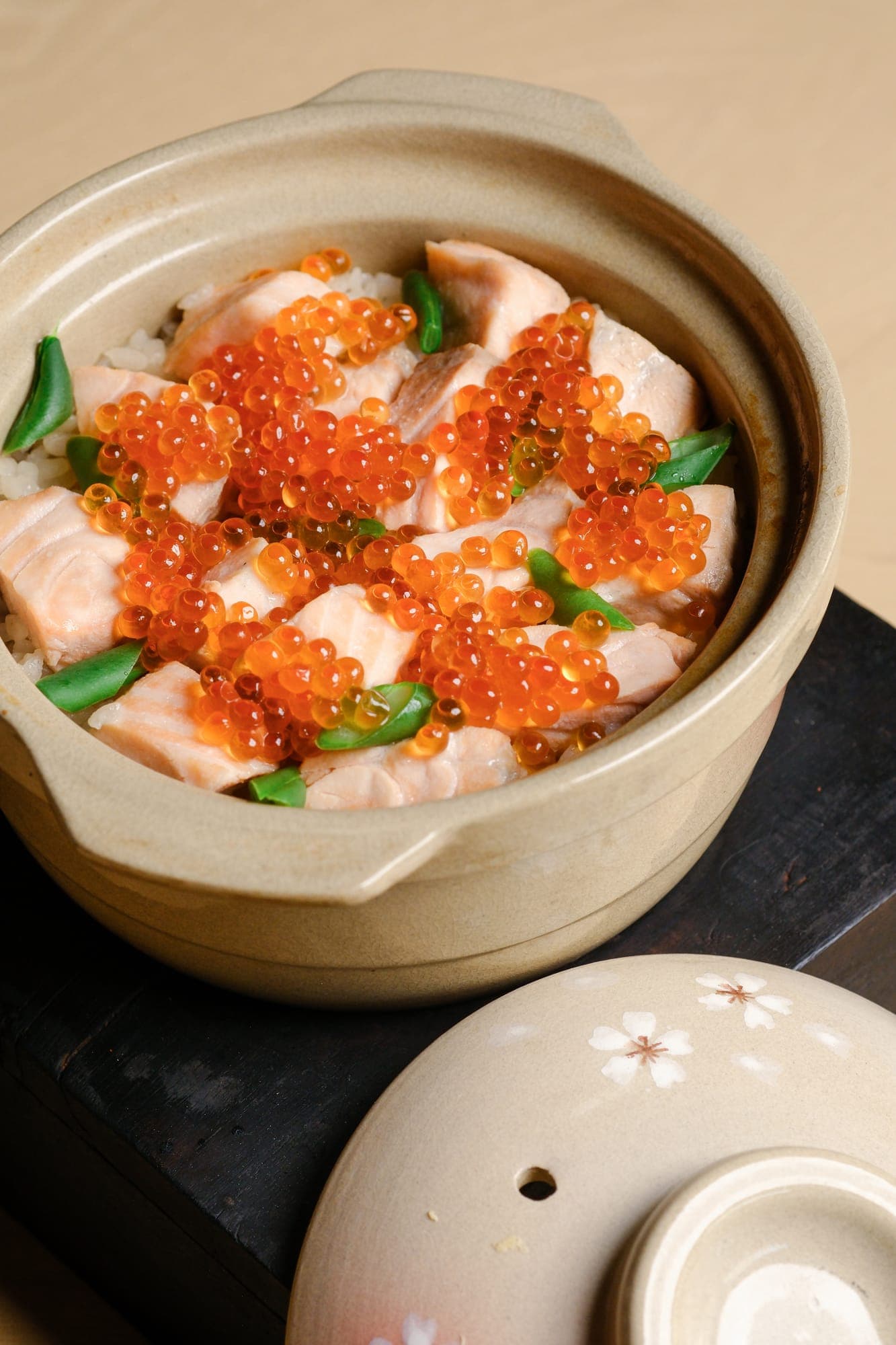 Salmon and ikura rice in a clay donabe