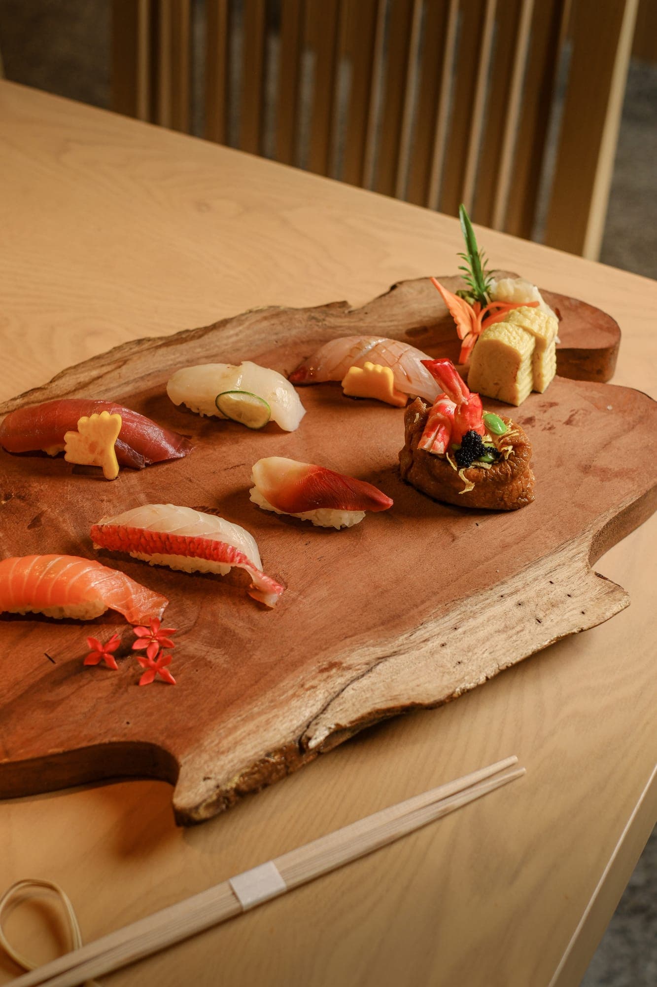 Omakase nigiri laid out on a wooden board