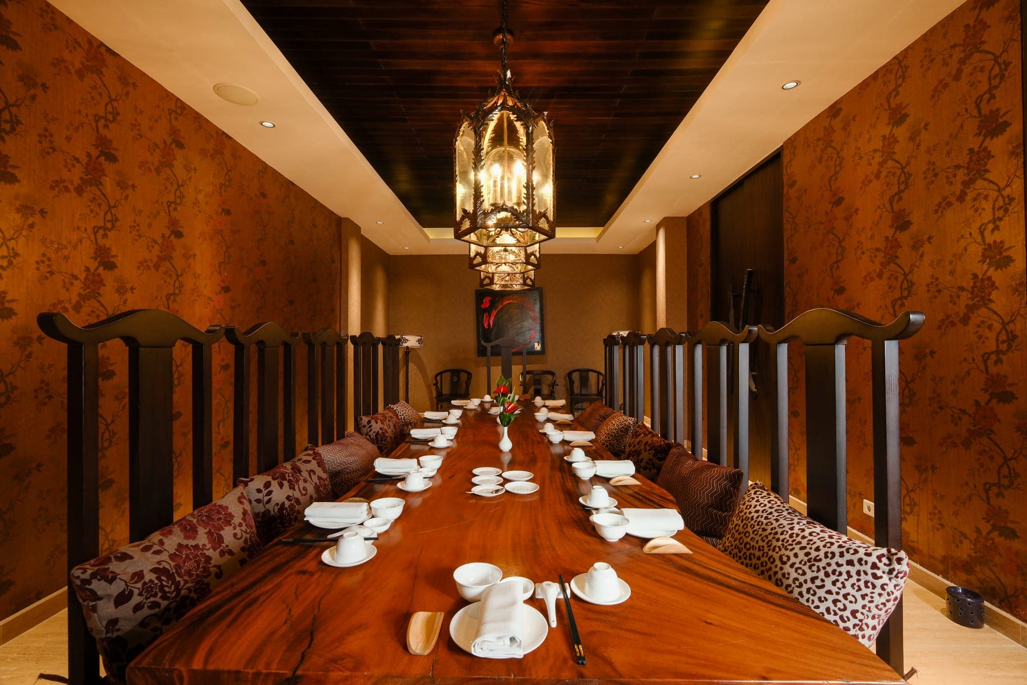 A long private banquet room set for dinner