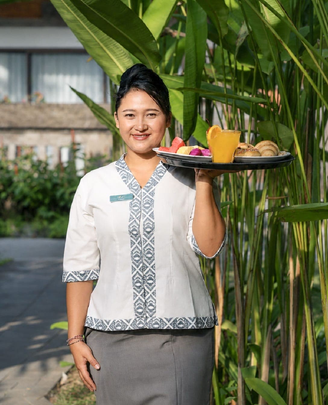A host welcoming guests with drinks