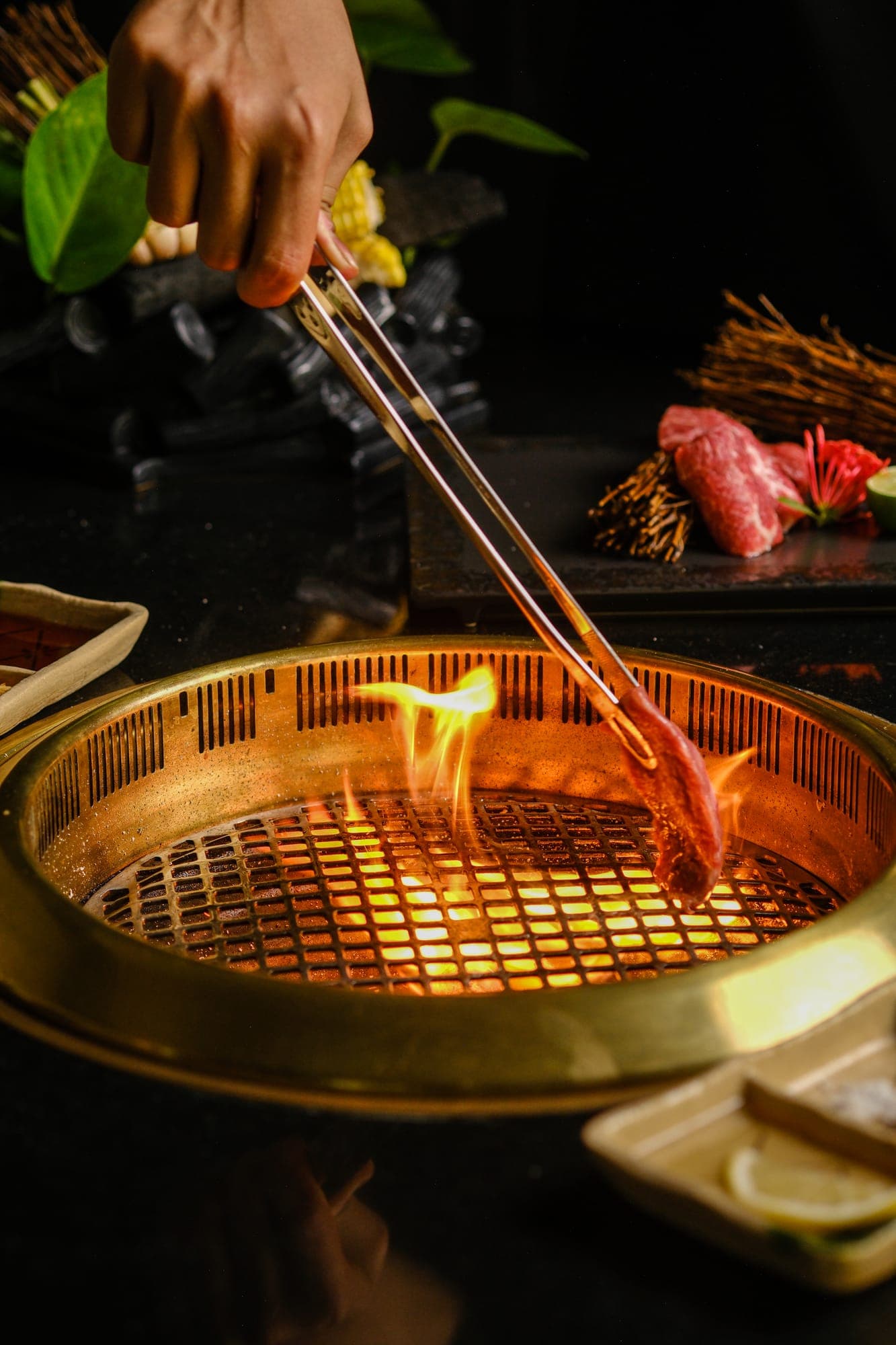 Wagyu flaring over a golden yakiniku grill