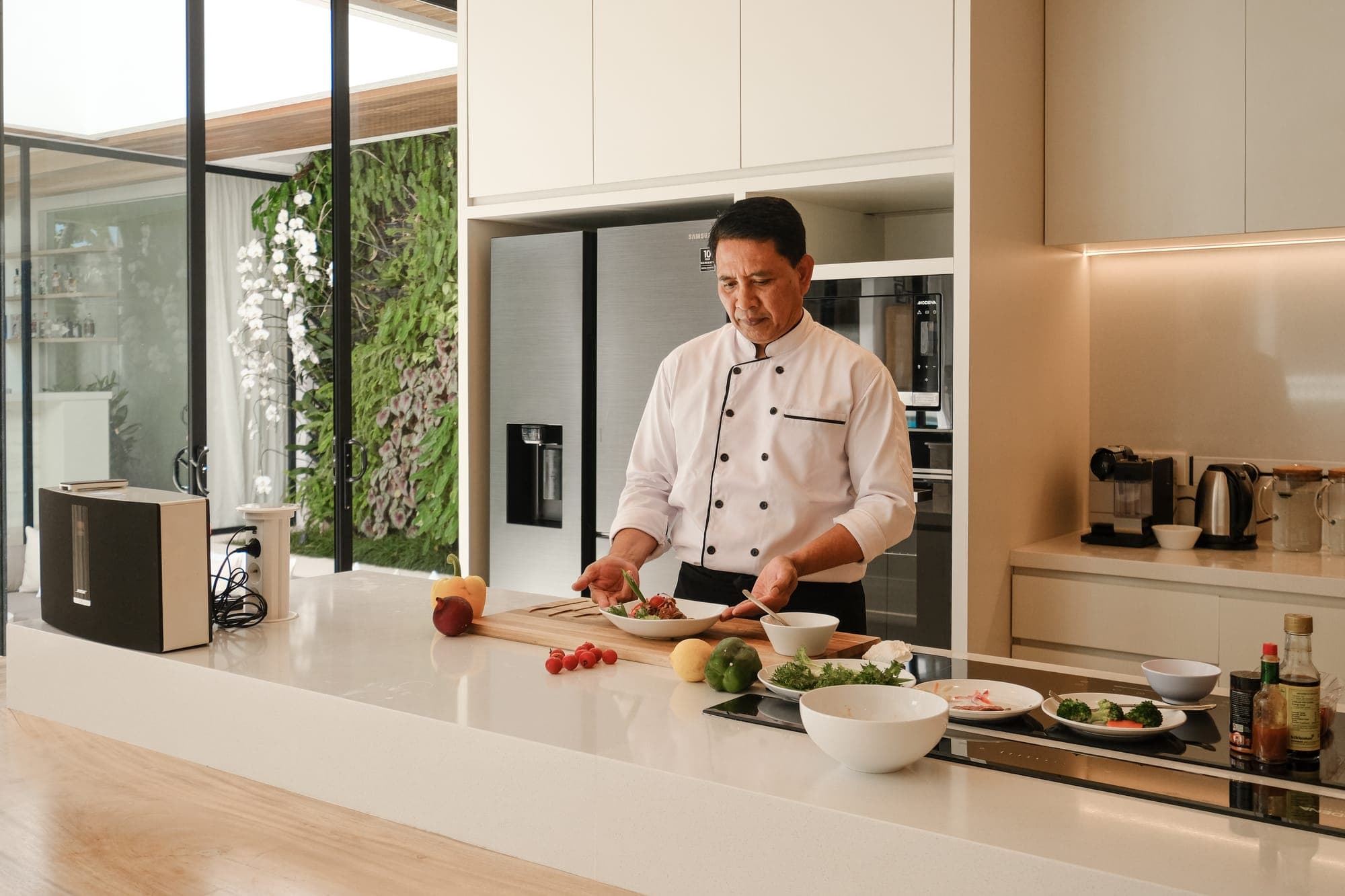 A private chef cooking in the villa kitchen