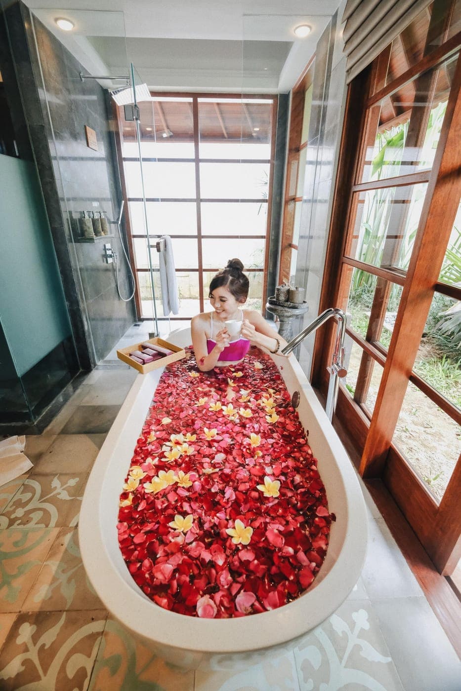 A guest in a rose-petal bath