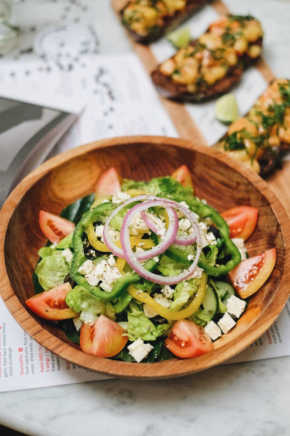 A fresh garden salad in a wooden bowl