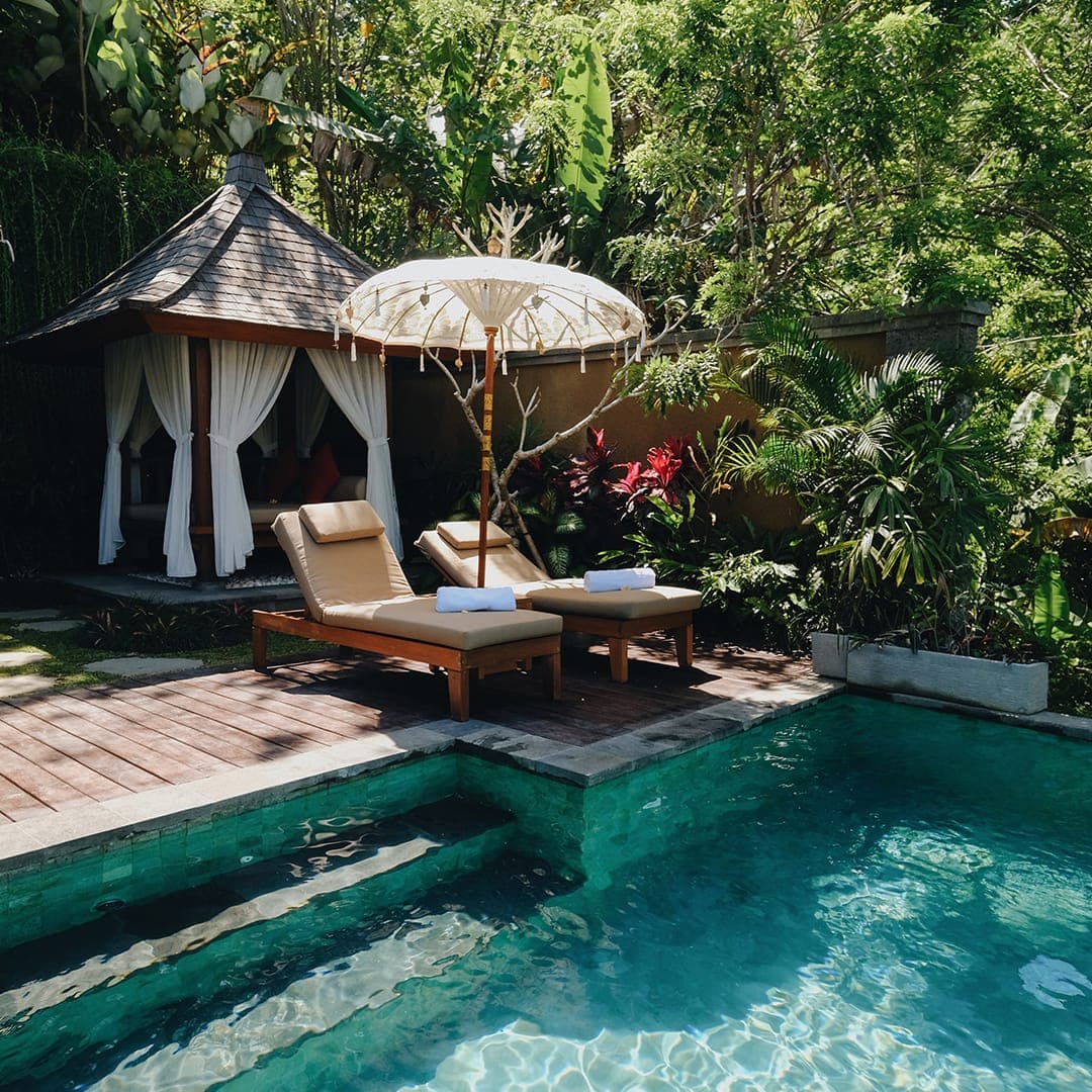 A pool and daybed gazebo in the jungle