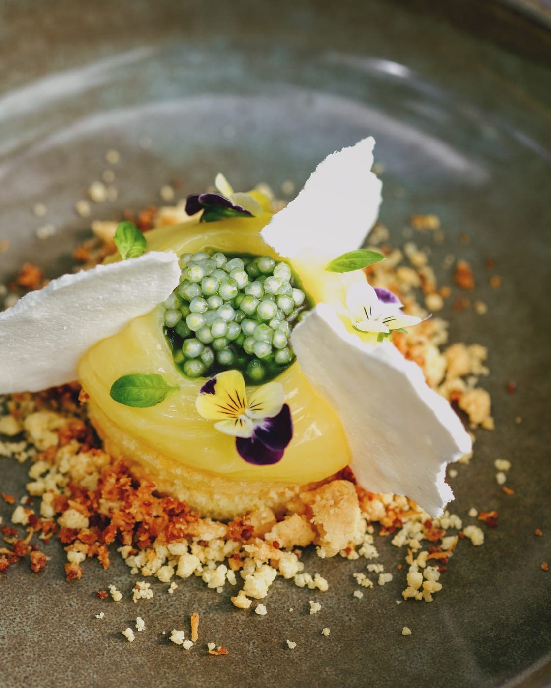 A plated dessert with edible flowers